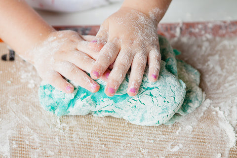 Child Making Playdough With Essential Oils